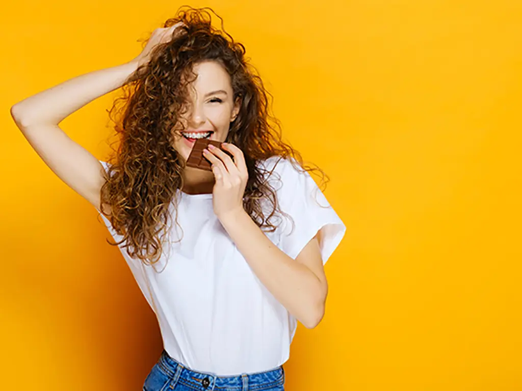 Take off those clear aligners before you snack and rinse well if you can't brush before putting them back on.